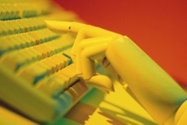 Hand of mannequin with computer keyboard